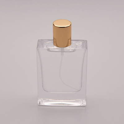 50ml μπουκάλι αρώματος επίπεδου γυαλιού με τη μικρή χρυσή ΚΑΠ